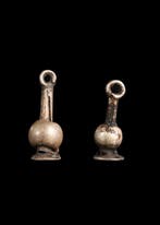 Oude Egypte, Nieuwe rijk Zilver Papaver Amulet Paar