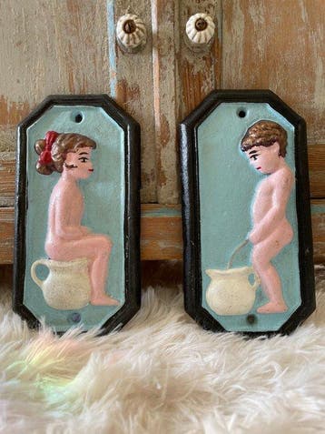 Decoratief ornament (2) - Set van twee gietijzeren