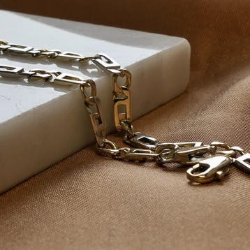 Bicolor gouden Figaro schakelarmband, Ophalen of Verzenden, Gebruikt, Overige kleuren, Goud