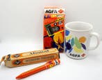 Agfa a set of items: camera, mug, pen, atomal Analoge camera, Nieuw