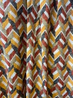 Exclusieve stof met geometrische patronen in dubbele hoogte,