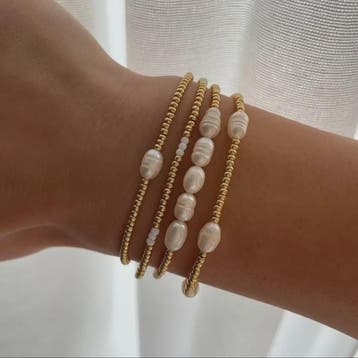 Set van 4 Elegante Armbanden met Goudkleurige Kralen en Pare, Verzenden, Nieuw