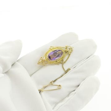 Gouden broche met amethist., Gebruikt, Ophalen of Verzenden, Met edelsteen, Goud