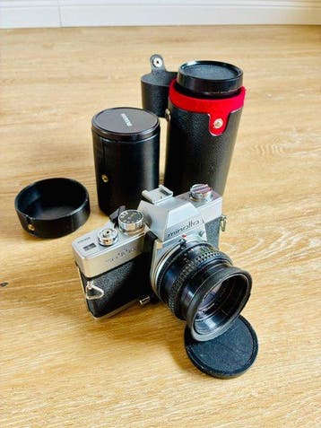 Minolta SR T 100 + Rokkor 1,7/50mm + Panagor 2,5/28mm +, Nieuw