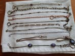 10 antieke diverse horloge kettingen varërend van 24 t/m 35