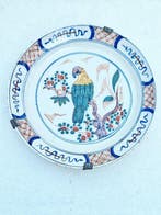 Gemerkt - Wandbord - Met papegaai of ara - Delfts blauw