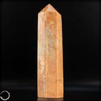 Majestueus perzik-maansteen obelisk – een symbool van kracht