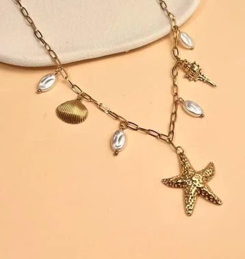 Ketting met zeesterren en schelpen, Nieuw, Ophalen of Verzenden, Goud, Overige materialen