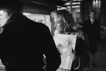 Ed Feingersh - Marilyn Gets A Paper, New York, 1955 Large