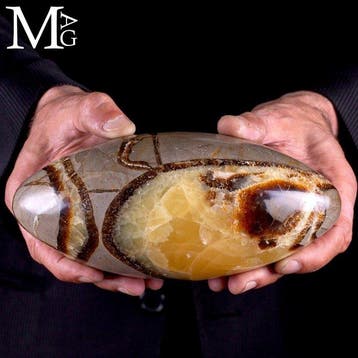 Septarische lingam met gouden calciet en rijke bruine