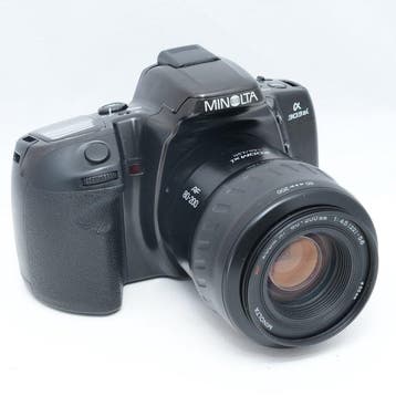 Minolta 303si + AF ZOOM xi .5-5.6/80-200mm | Analoge camera, Nieuw