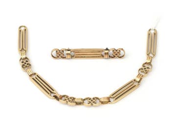 Een geelgouden schakelarmband en broche, Gebruikt