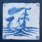 Tegel - Delfts blauwe tegel met een zeewezen met een fakkel