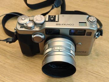 Contax G2 + Carl Zeiss Planar 45mm f/2 lens Analoge camera, Audio, Tv en Foto, Fotocamera's Analoog, Nieuw