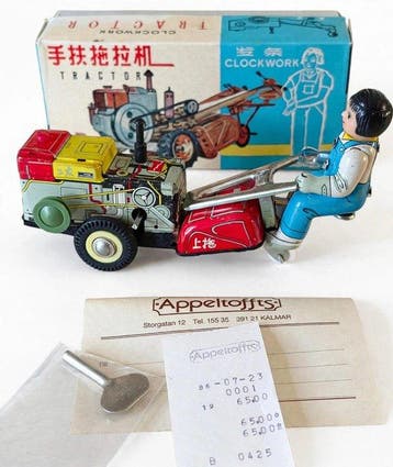 Zeldzame litho blikken handtractor met opwindsleutel en doos