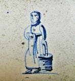 Tegel - Oude vrouw met haakneus, traditionele kledij en